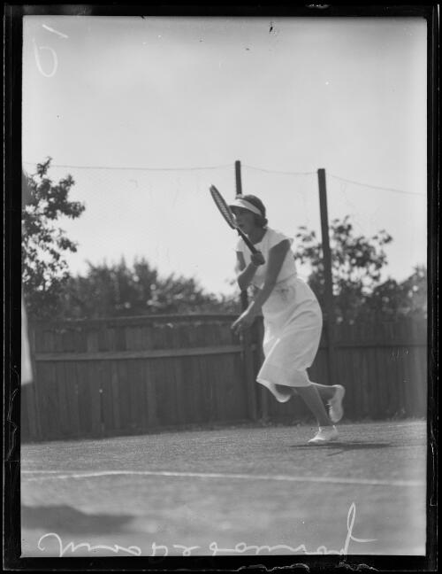 Tennis player Miss Marie De Launay with racquet in hand after taking a shot on the tennis court, New South Wales, 20 October 1933 [picture]