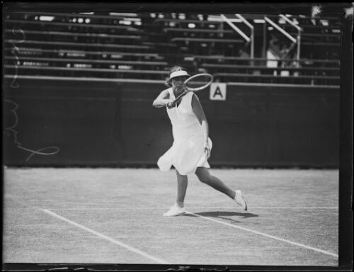 Mrs H.S. Utz after hitting a forehand shot on the tennis court, New South Wales, 25 January 1934 [picture]