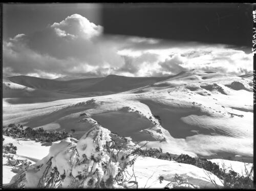 Sunshine & shadow from [Mount] Guthrie on main range [picture] : [Kosciuszko, New South Wales] / [Frank Hurley]