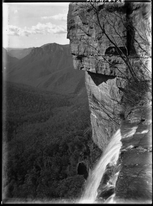 [Waterfall, valley, bush setting] [picture] : [Kosciuszko, New South Wales] / [Frank Hurley]