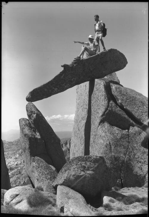 Summit of Mt Townshend two figures standing on top rocks [picture] : [Kosciuszko, New South Wales] / [Frank Hurley]