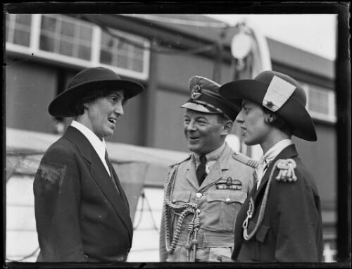 Lady Baden-Powell talking with a uniformed man and women upon her arrival on the ship Marama in Sydney, New South Wales, March 1931 [picture]