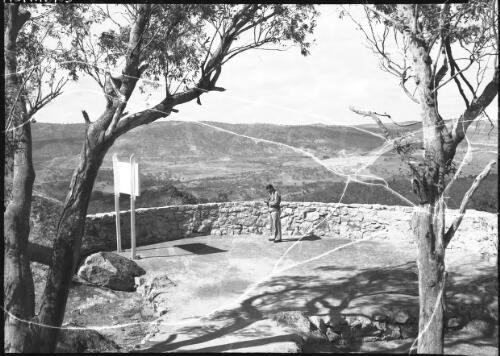 [A man at a scenic lookout] [picture] : [Snowy Mountains Hydro-Electric Scheme, New South Wales] / [Frank Hurley]