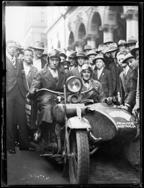 Reginald James and Harold E. Wratten leaving the General Post Office in Martin Place on their motor cycle world tour, Sydney, 31 July 1930, 1 [picture] / Ray Olson