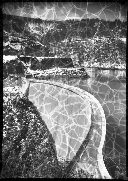 Tumut Ponds Dam [showing much of the retaining wall] [picture] : [Snowy Mountains Hydro-Electric Scheme, New South Wales] / [Frank Hurley]