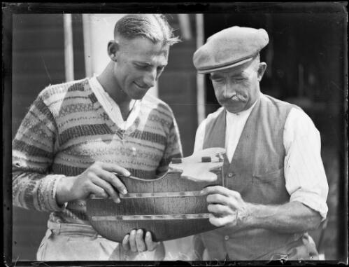 Sculler Bobby Pearce with another man examining a rudder, New South Wales, ca. 1930s [picture]