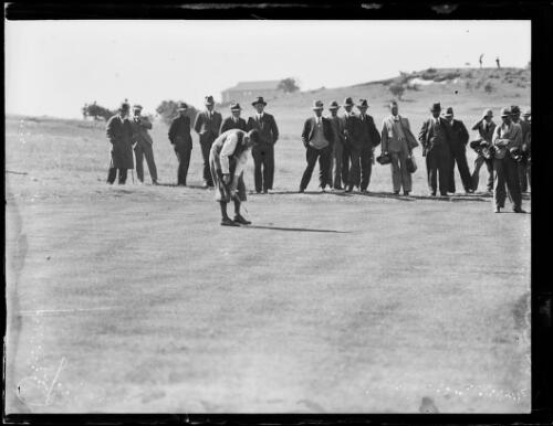 Amateur golfer H. Williams putting in front of crowd, New South Wales, ca. 1930s, 2 [picture]