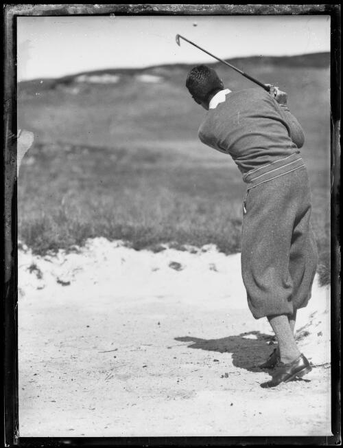 Amateur golfer H. Williams wedging a golf ball onto the course, New South Wales, ca. 1930s [picture]