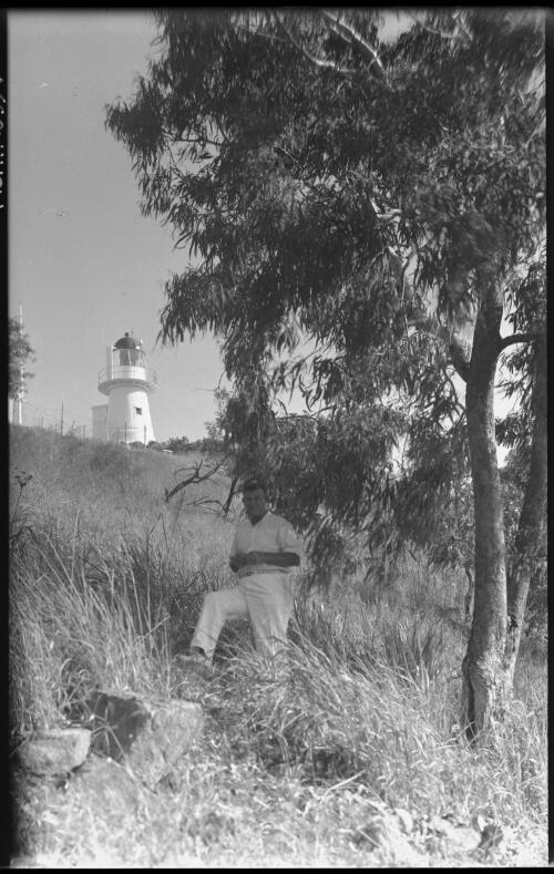 [Man on hill below lighthouse, Manly, 2] [picture] : [Sydney, New South Wales] / [Frank Hurley]