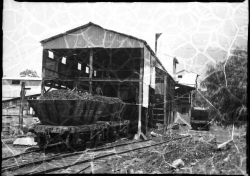 Loading bunker with coal cars, Pelton Mine, New South Wales, 1 [picture] / Frank Hurley