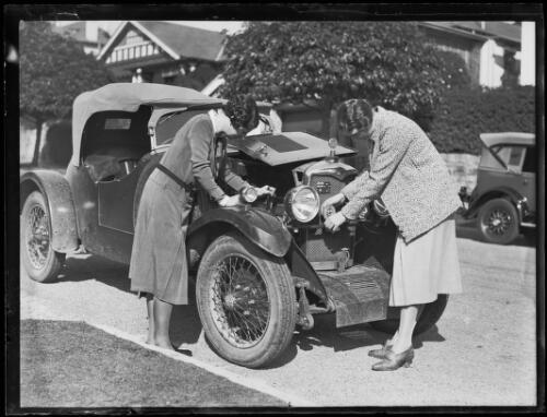 Motorists Miss K. Howell and Miss J.O. Robertson working on their car, New South Wales, 7 August 1931 [picture]
