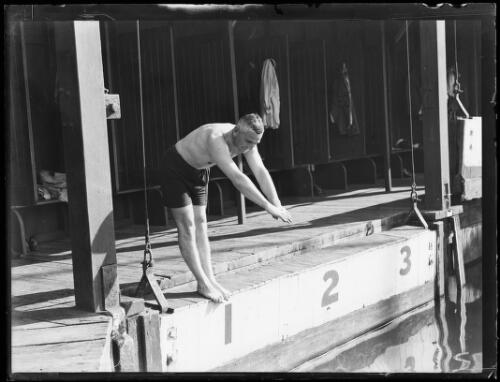 Swimmer D. Ingram preparing to dive into a pool, New South Wales, 13 July 1929 [picture]