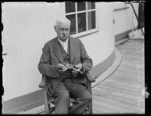Ophthalmologist Sir Henry Lindo Ferguson sitting on the deck of a ship, New South Wales, ca. 1928 [picture]