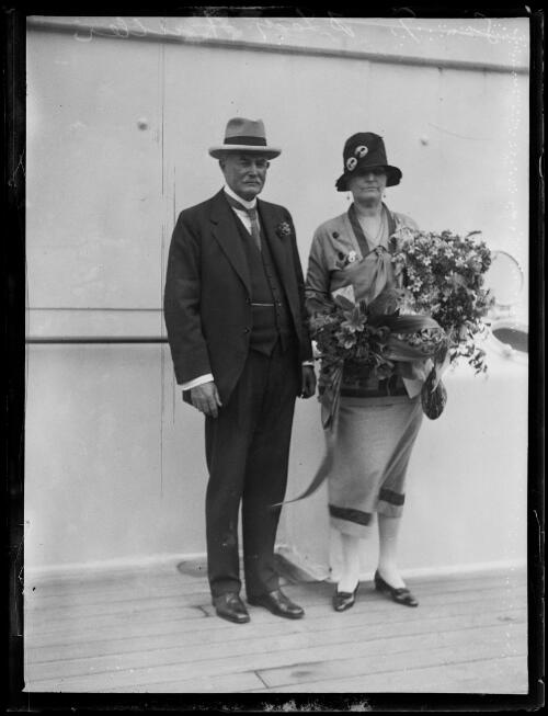 Sir George and Lady Fuller holding a bouquet of flowers onboard a ship, New South Wales, ca. 1927, 2 [picture]