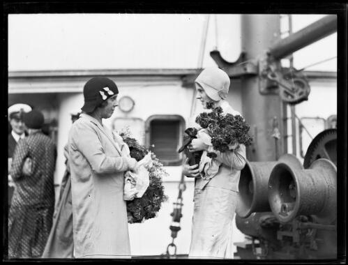 Mrs Bavin and Miss Valerie Bavin holding bouquets of flowers, New South Wales, ca. 1930s, 2 [picture]