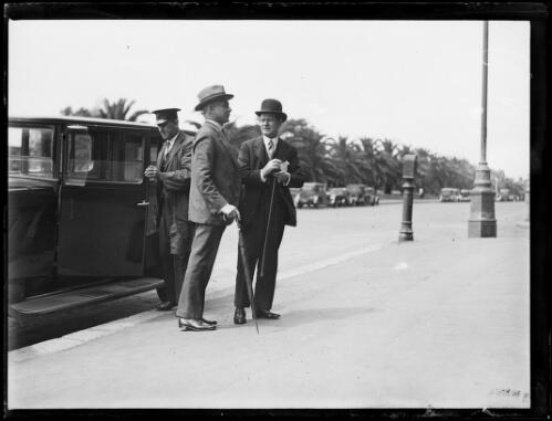 Mr Thomas Rainsford Bavin talking to an unidentified man beside a car and driver, New South Wales, ca. 1930s [picture]
