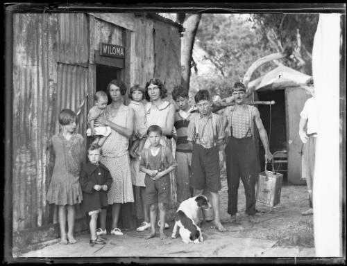 A family standing outside a tin shack called Wiloma during the Great Depression, New South Wales, ca. 1932 [picture]