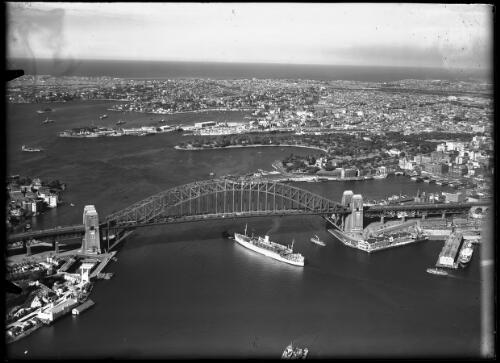 [Aerial view of the Sydney Harbour Bridge and city looking east] [picture] : [Sydney, New South Wales] / [Frank Hurley]