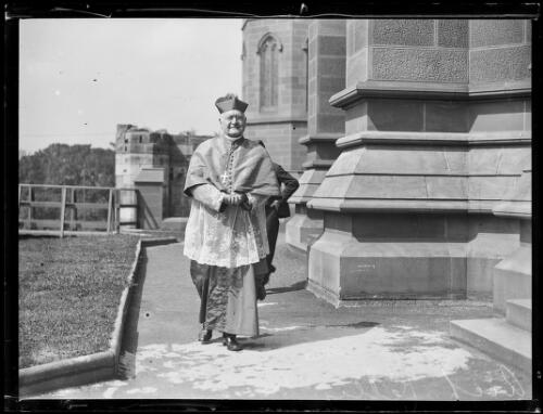 Archbishop Michael Kelly walking in the grounds of St Mary's Cathedral, Sydney, ca. 1920 [picture]