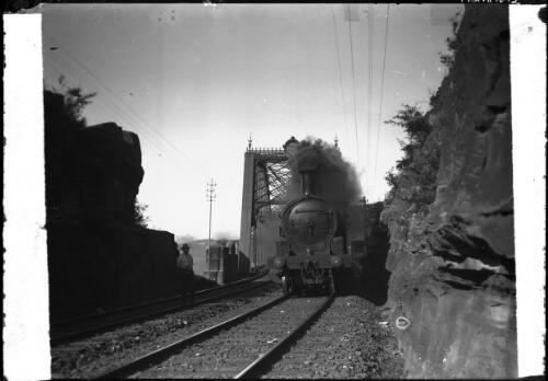 [The Hawkesbury train passing over a bridge] [picture] : [New South Wales] / [Frank Hurley]