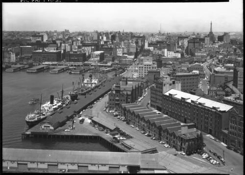 [Birds-eye view of Circular Quay, including the ferry terminals and the Rocks] [picture] : [Sydney, New South Wales] / [Frank Hurley]