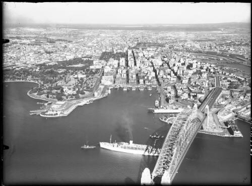 Sydney Harbour showing bridge, Opera House under construction, the city and Darling Harbour, Sydney [picture] / Frank Hurley