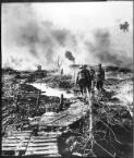 [Four Australian troops walking over duckboards in the waterlogged fields Flanders, October 1917] [picture] : [World War I] / [Frank Hurley]