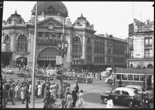 [Flinders Street Station, intersection with people, a tram and traffic] [picture] : [Melbourne, Victoria] / [Frank Hurley]