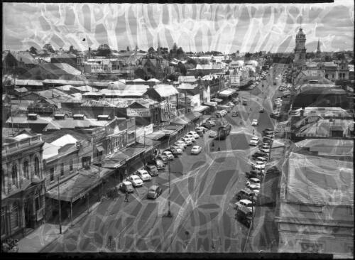 [Geelong, Ryrie Street, trams, cars, shops] [picture] : [Victoria] / [Frank Hurley]