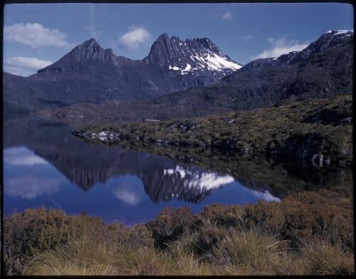 [Snow-capped Cradle Mountain with Dove Lake in foreground, Tasmania, 2] [transparency] / [Frank Hurley]