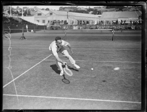Tennis player J. Willard reaching to hit a low forehand shot, New South Wales, ca. 1930 [picture]