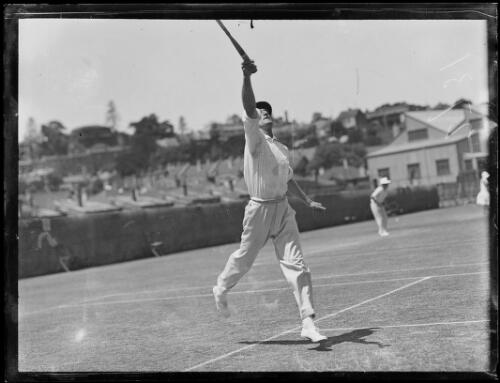 Tennis player J. Willard reaching to return a high ball, New South Wales, ca. 1930 [picture]
