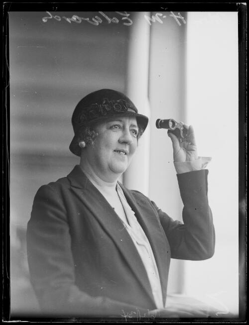 Mrs H.M. Edwards wife of Admiral Edwards using opera binoculars, New South Wales, 16 April 1934 [picture]
