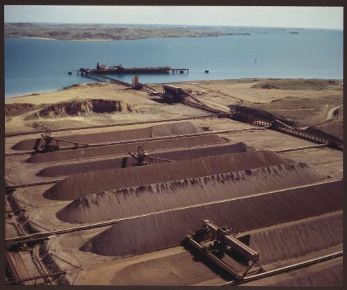 Hamersley Iron stockpiling iron ore for export, Dampier, Western Australia, 1975 [2] [picture] / Wolfgang Sievers