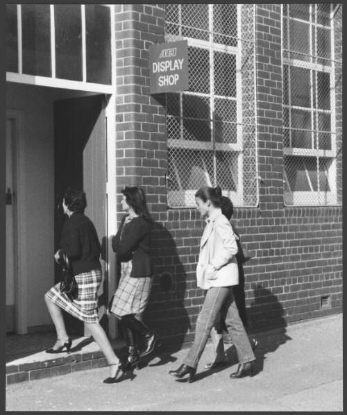 Four unidentified women entering the Australian Glass Manufacturers employee's shop, Spotswood, Victoria,1983 [picture] / Wolfgang Sievers