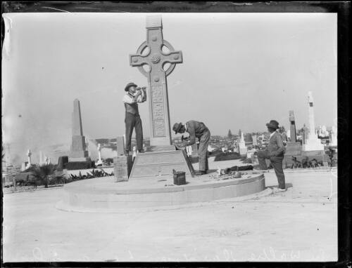 Man watching two stone masons working on Sir Walter Davidson's Memorial, New South Wales, 1925 [picture]
