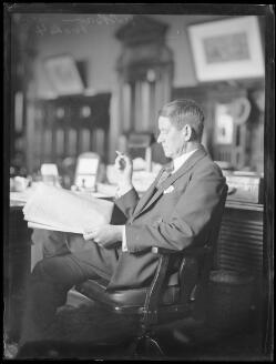 Premier of New South Wales Sir Thomas Rainsford Bavin reading at a desk ...