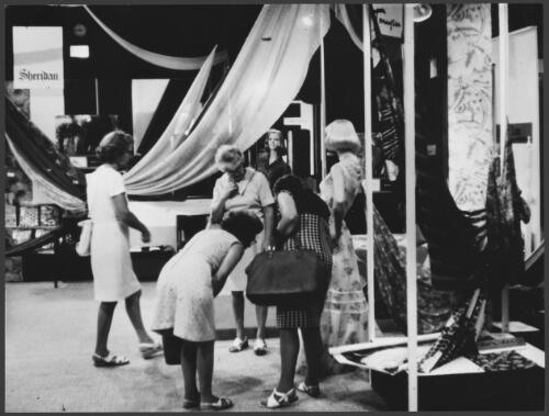 [Women inspecting a dress at the Australian] Wool Board fashion parade, [ca.1975] [picture] / Wolfgang Sievers