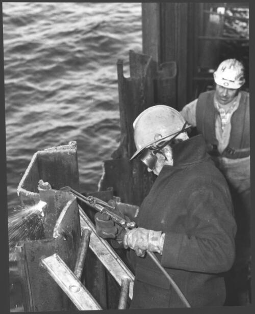 [Welder at] Snapper Crossing harbour installation, Gippsland coast, Victoria, 1979, John Holland [picture] / Wolfgang Sievers
