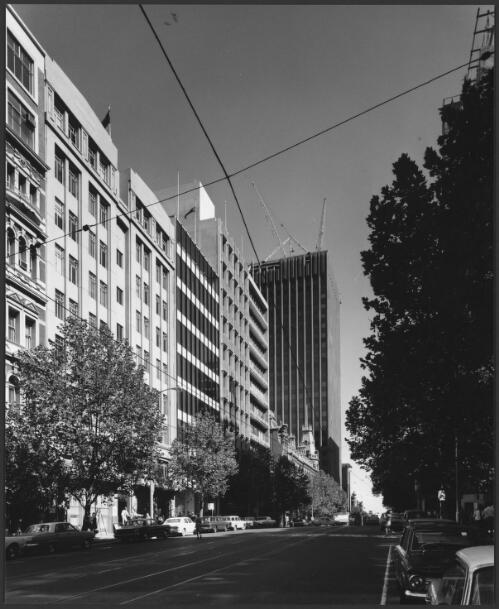 Bourke Street, looking west from Queen Street, with AMP-St. James building under construction, Melbourne, Victoria, 1969 [picture] / Wolfgang Sievers