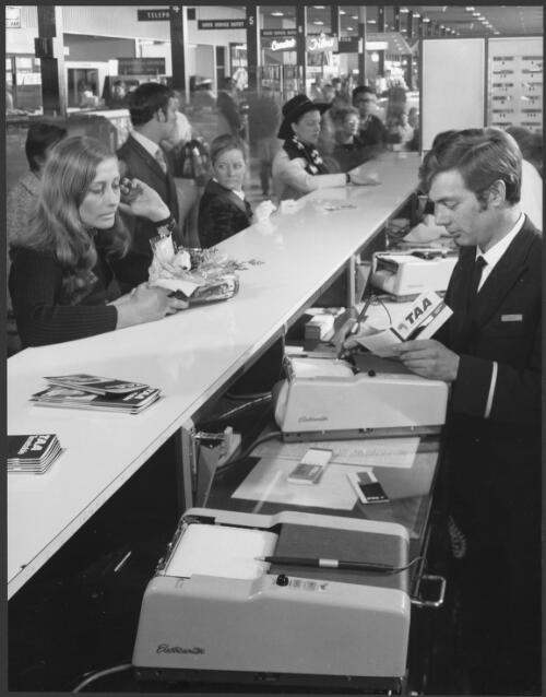 [Customers and staff at airline ticket counter, and] Plessey Instruments, Essendon Airport, Victoria, 1970 [picture] / Wolfgang Sievers