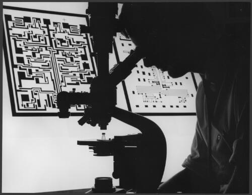 [Silhouette of a scientist looking through a microscope at] Plessey Research Laboratories, Flemington, Victoria, 1963 [picture] / Wolfgang Sievers