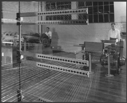 Men operating looms at Lucas textiles factory, Ballarat, Victoria, 1963 [2] [picture] / Wolfgang Sievers