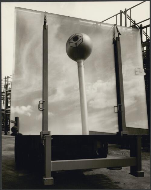 Sheet of Pilkington glass on a stand, with reflection of a tower, Dandenong, 1974 [picture] / Wolfgang Sievers