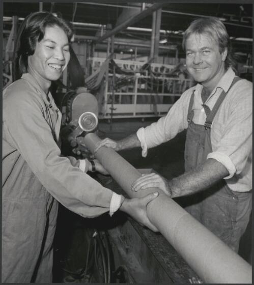 Two employees holding a cardboard tube at A.C.I. Pak Pacific, Bulleen, Victoria, 1983 [picture] / Wolfgang Sievers