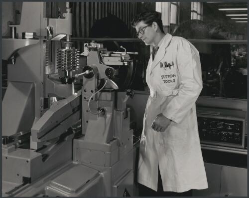 Sutton Tools employee attending metal lathe, Clifton Hill, Melbourne, 1960, 2 [picture] / Wolfgang Sievers