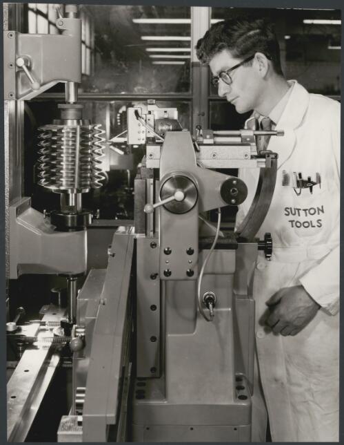 Sutton Tools employee attending metal lathe, Clifton Hill, Melbourne, 1960, 4 [picture] / Wolfgang Sievers