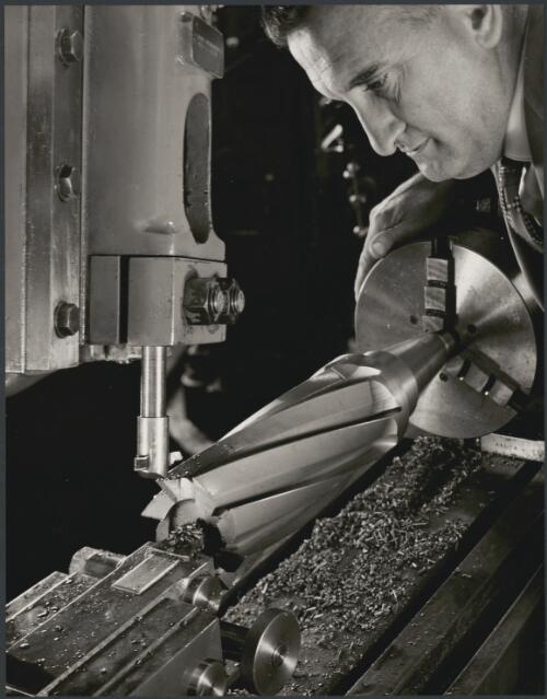 Tool and die maker with metal lathe at Sutton Tools, Melbourne, 1960, 2 [picture] / Wolfgang Sievers