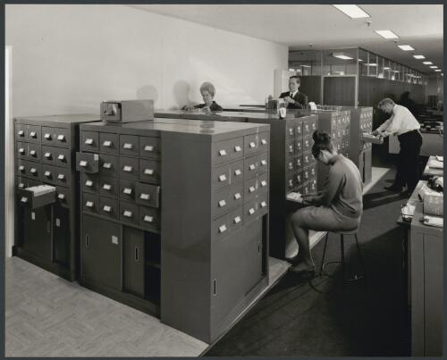 Office workers using filing cabinets at Remington Rand, City road, South Melbourne, Victoria, 1968 [picture] / Wolfgang Sievers