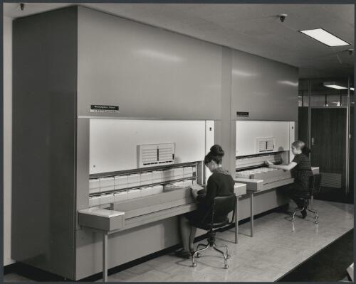 Employees using file cabinet at Remington Rand, City road, South Melbourne, Victoria, 1968 [picture] / Wolfgang Sievers
